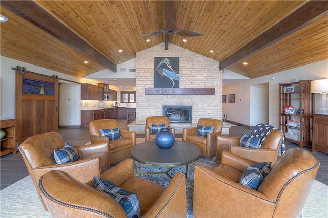 101 Algonquin Dr, Lake Winnebago, MO 64034 - living room featuring a ceiling fan, a barn door, wood ceiling, a fireplace, and recessed lighting