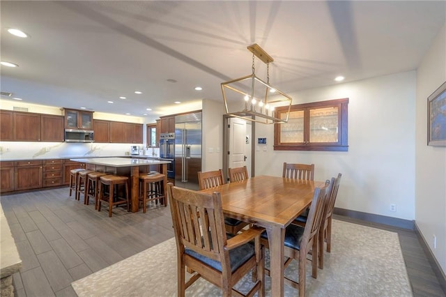 101 Algonquin Dr, Lake Winnebago, MO 64034 - dining room featuring recessed lighting, dark wood-type flooring, and baseboards