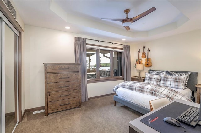 101 Algonquin Dr, Lake Winnebago, MO 64034 - carpeted bedroom featuring recessed lighting, baseboards, a tray ceiling, ceiling fan, and a closet