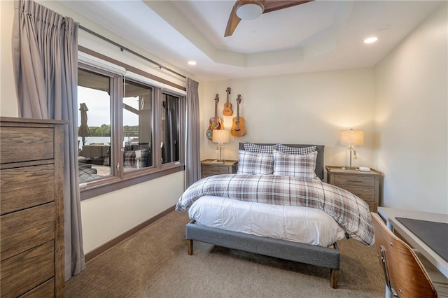 101 Algonquin Dr, Lake Winnebago, MO 64034 - carpeted bedroom with baseboards, recessed lighting, ceiling fan, and a tray ceiling