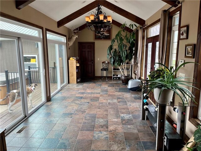 908 Cedar Ct, Paola, KS 66071 - sunroom with a chandelier and french doors