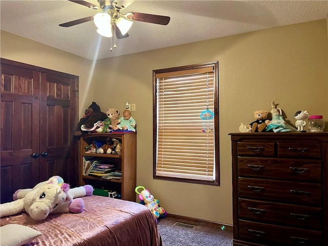 908 Cedar Ct, Paola, KS 66071 - bedroom with carpet, ceiling fan, baseboards, and a closet