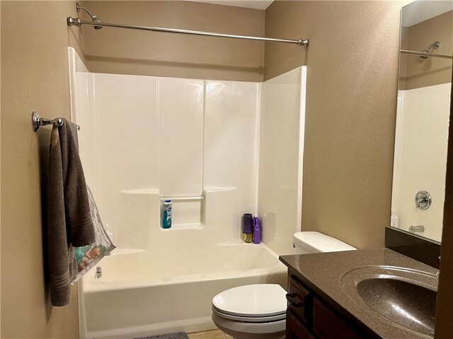 908 Cedar Ct, Paola, KS 66071 - bathroom featuring toilet, shower / bath combination, and vanity