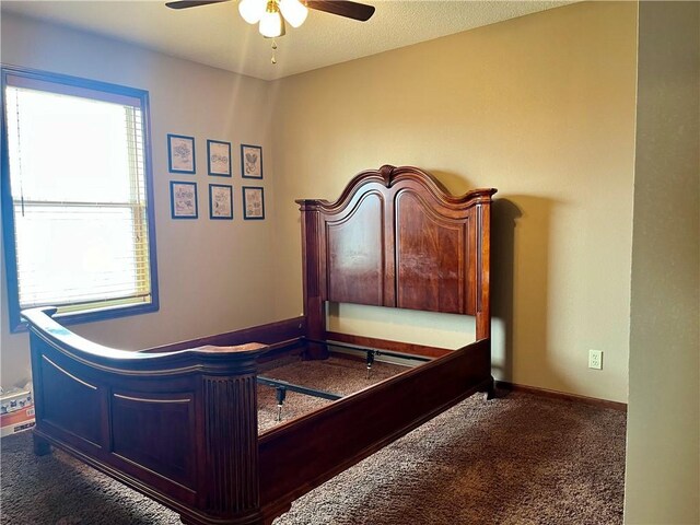908 Cedar Ct, Paola, KS 66071 - carpeted bedroom featuring a ceiling fan and baseboards