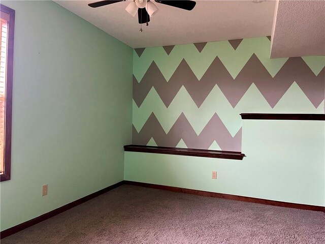 908 Cedar Ct, Paola, KS 66071 - empty room featuring ceiling fan, carpet floors, and baseboards