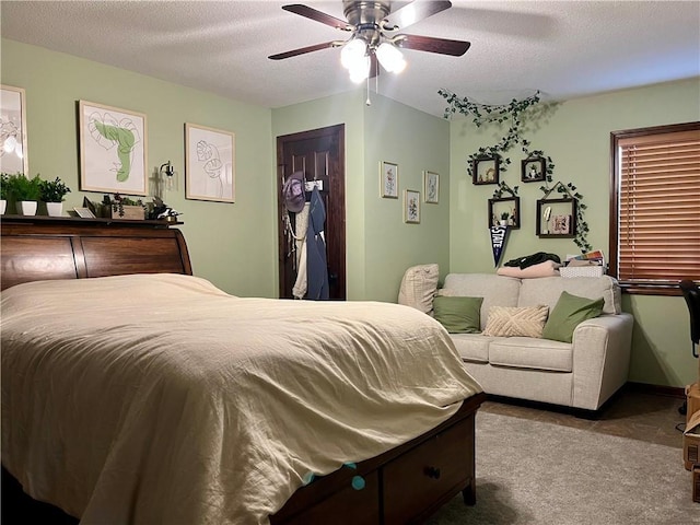 908 Cedar Ct, Paola, KS 66071 - carpeted bedroom featuring a textured ceiling and ceiling fan