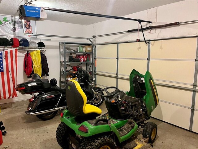 908 Cedar Ct, Paola, KS 66071 - garage featuring a garage door opener