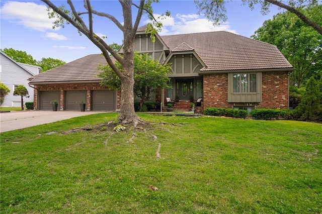 3705 W 119th Ter, Leawood, KS 66209 - tudor house with brick siding, concrete driveway, a tiled roof, a front lawn, and an attached garage