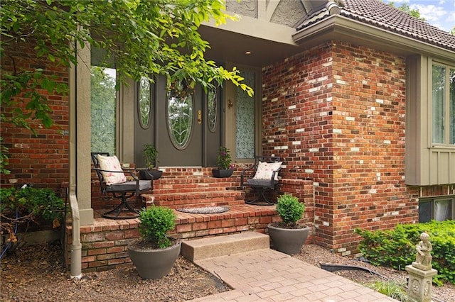 3705 W 119th Ter, Leawood, KS 66209 - doorway to property featuring brick siding and a porch