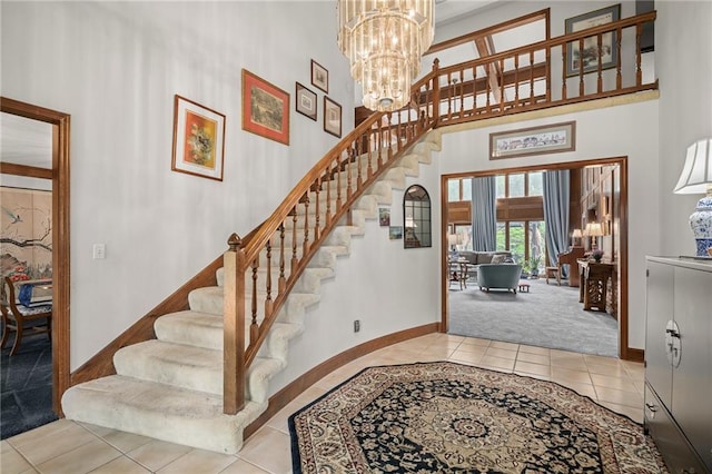 3705 W 119th Ter, Leawood, KS 66209 - tiled entrance foyer with baseboards, stairway, a high ceiling, a chandelier, and carpet