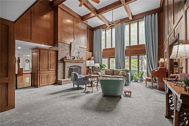 3705 W 119th Ter, Leawood, KS 66209 - living room with ceiling fan, carpet flooring, beam ceiling, a fireplace, and coffered ceiling