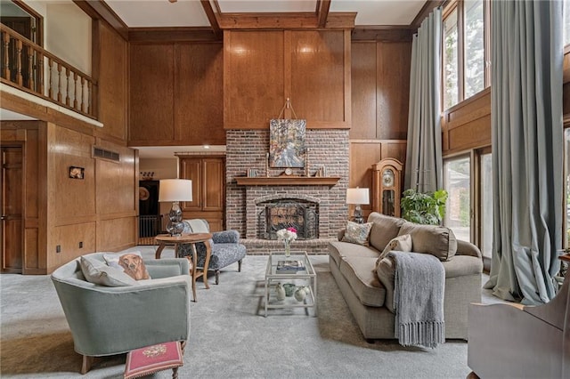 3705 W 119th Ter, Leawood, KS 66209 - living room featuring carpet floors, a towering ceiling, a decorative wall, wood walls, and beam ceiling
