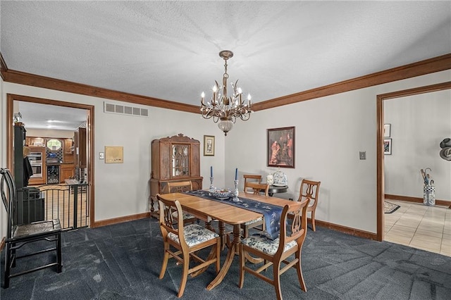 3705 W 119th Ter, Leawood, KS 66209 - dining room with a chandelier, crown molding, baseboards, dark carpet, and a textured ceiling