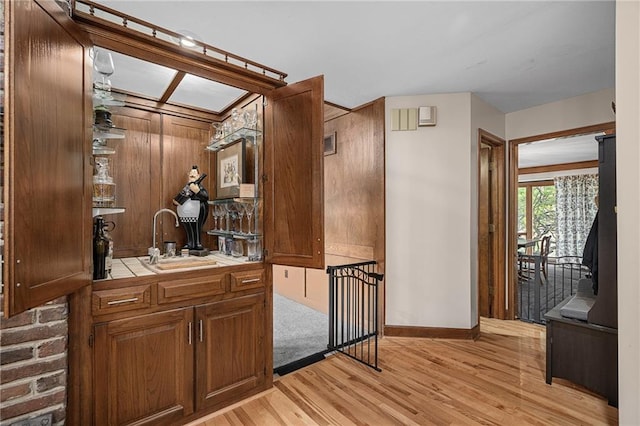 3705 W 119th Ter, Leawood, KS 66209 - indoor wet bar featuring light wood-type flooring and baseboards