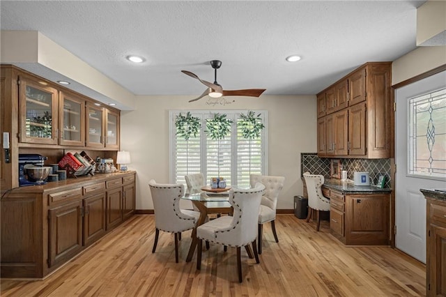 3705 W 119th Ter, Leawood, KS 66209 - dining space with ceiling fan, light wood-type flooring, baseboards, recessed lighting, and a textured ceiling