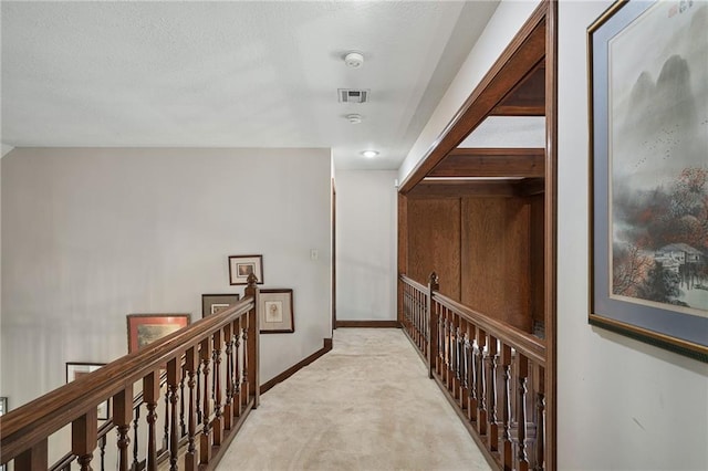 3705 W 119th Ter, Leawood, KS 66209 - hall with light carpet, an upstairs landing, and baseboards