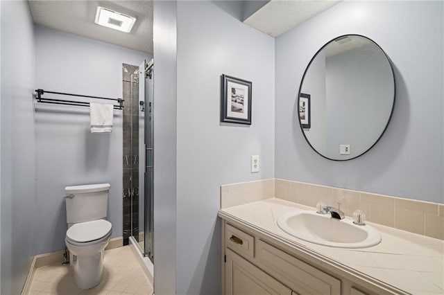 3705 W 119th Ter, Leawood, KS 66209 - bathroom with toilet, vanity, a stall shower, and tile patterned floors