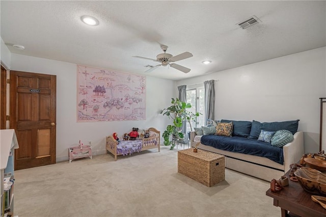 3705 W 119th Ter, Leawood, KS 66209 - carpeted living area with ceiling fan, a textured ceiling, and recessed lighting