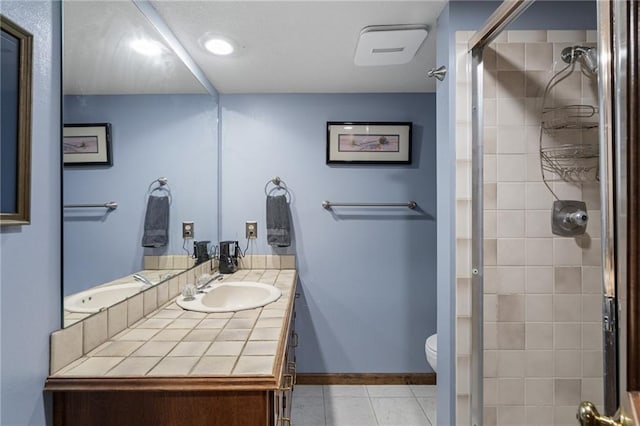 3705 W 119th Ter, Leawood, KS 66209 - full bath with a shower stall, toilet, tile patterned flooring, vanity, and baseboards