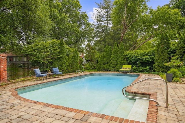 3705 W 119th Ter, Leawood, KS 66209 - view of pool featuring fence, a patio area, and view of wooded area