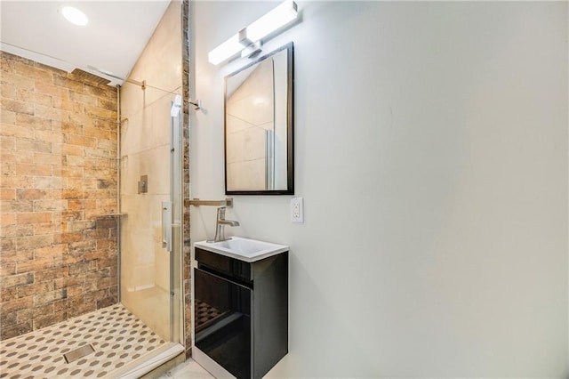 full bath featuring vanity and a stall shower