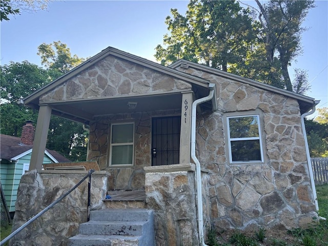 6941 Spruce Ave, Kansas City, MO 64132 - view of front facade featuring stone siding
