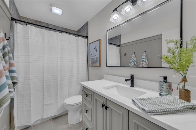 bathroom with curtained shower, toilet, tile patterned flooring, and vanity