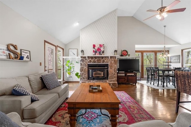 living room with high vaulted ceiling, wood finished floors, and a ceiling fan