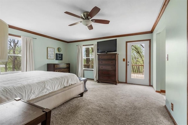 bedroom with carpet floors, ornamental molding, access to outside, and multiple windows