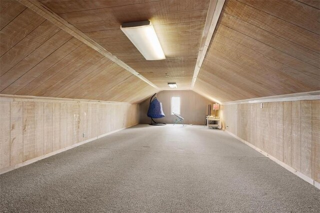 bonus room with lofted ceiling, carpet flooring, and wooden ceiling