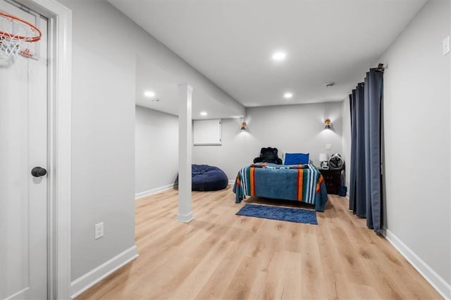 interior space featuring light wood-type flooring, recessed lighting, and baseboards