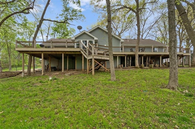back of house with stairway, a wooden deck, and a yard