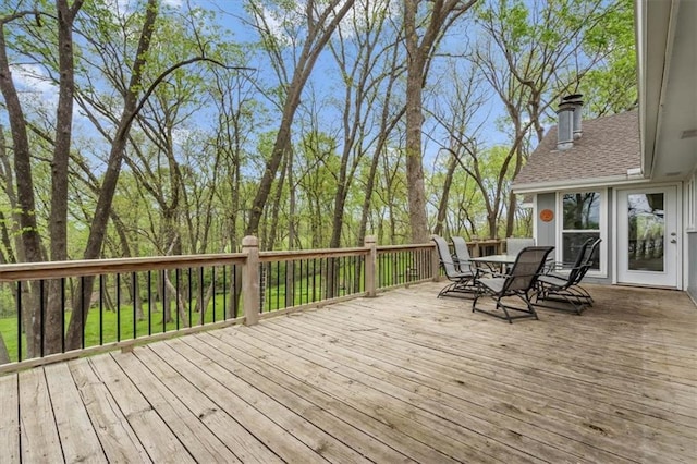 wooden deck featuring outdoor dining space