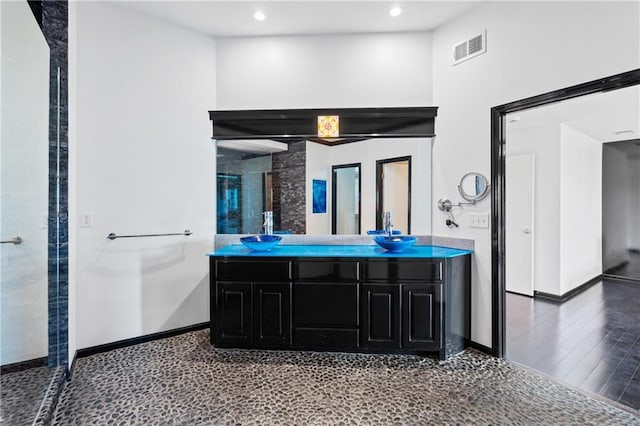 11273 S Lakecrest Dr, Olathe, KS 66061 - bathroom with double vanity, a shower stall, baseboards, and recessed lighting