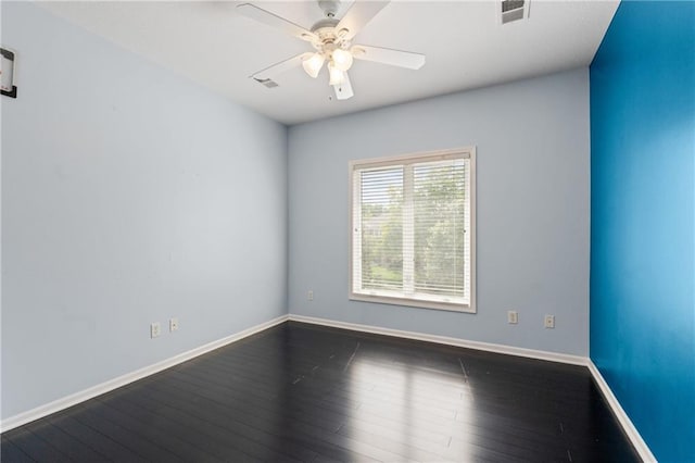 11273 S Lakecrest Dr, Olathe, KS 66061 - empty room featuring dark wood-type flooring, a ceiling fan, and baseboards