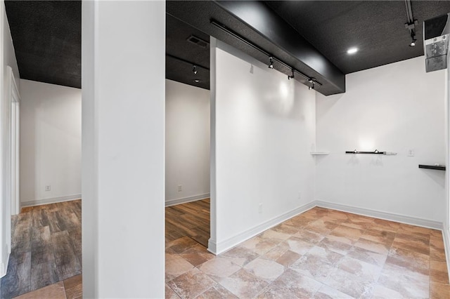 11273 S Lakecrest Dr, Olathe, KS 66061 - basement featuring track lighting and baseboards