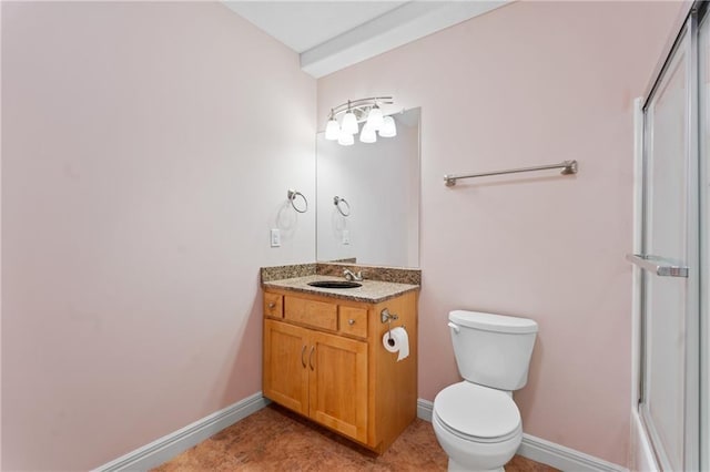 11273 S Lakecrest Dr, Olathe, KS 66061 - full bath with vanity, toilet, a shower, and baseboards