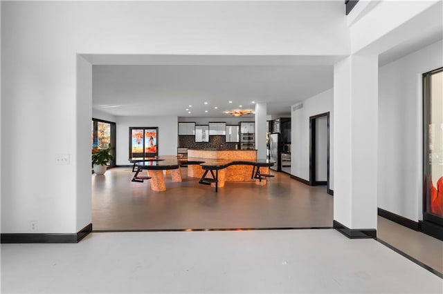 11273 S Lakecrest Dr, Olathe, KS 66061 - recreation room with concrete floors, baseboards, and recessed lighting