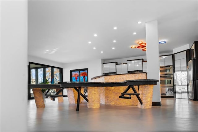 11273 S Lakecrest Dr, Olathe, KS 66061 - interior space featuring recessed lighting and concrete flooring