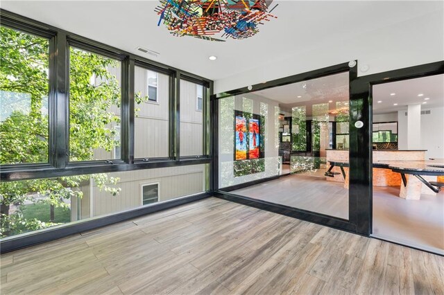 11273 S Lakecrest Dr, Olathe, KS 66061 - doorway featuring wood finished floors and plenty of natural light