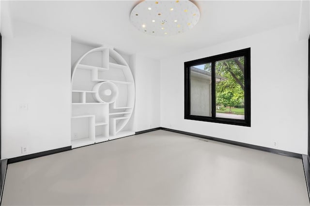 11273 S Lakecrest Dr, Olathe, KS 66061 - empty room featuring concrete floors