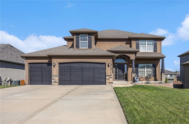 view of front of home featuring driveway, stone siding, an attached garage, a front yard, and stucco siding