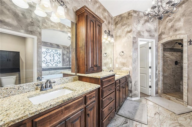 full bathroom with a bath, an inviting chandelier, walk in shower, marble finish floor, and vanity
