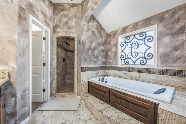 bathroom featuring a bath, vanity, tile walls, marble finish floor, and tiled shower