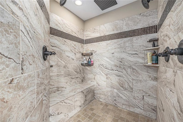 bathroom with a tile shower