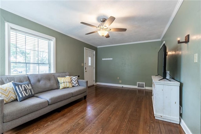1306 W 29th St S, Independence, MO 64052 - living room with dark wood-style flooring, ceiling fan, and ornamental molding