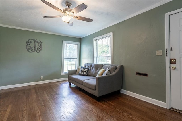 1306 W 29th St S, Independence, MO 64052 - living area featuring dark wood finished floors, a ceiling fan, and ornamental molding