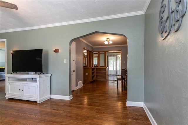 1306 W 29th St S, Independence, MO 64052 - corridor with arched walkways, wood finished floors, and crown molding