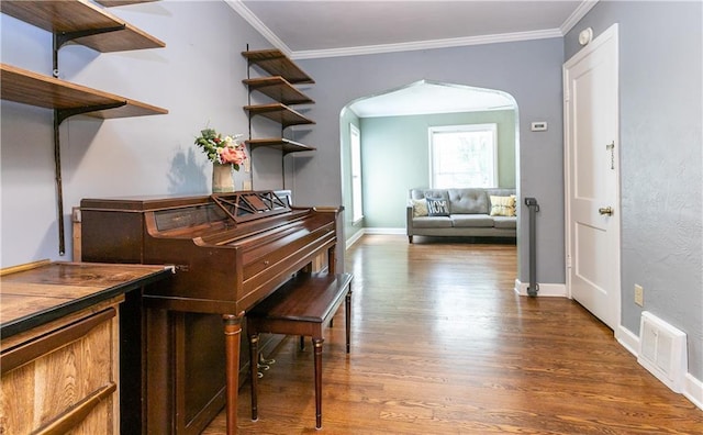 1306 W 29th St S, Independence, MO 64052 - hallway with arched walkways, wood finished floors, and crown molding