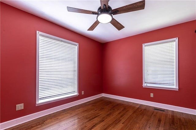 1306 W 29th St S, Independence, MO 64052 - spare room with ceiling fan and dark wood-style floors